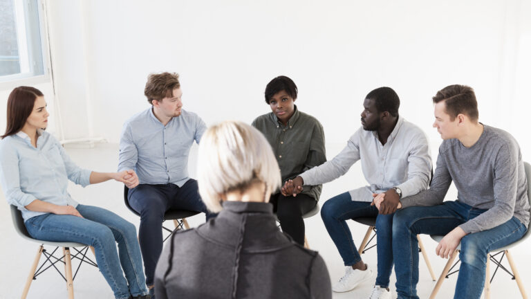 rehab patient fighting together with addiction